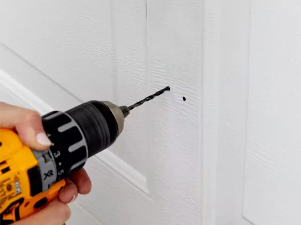 drill hole in garage door